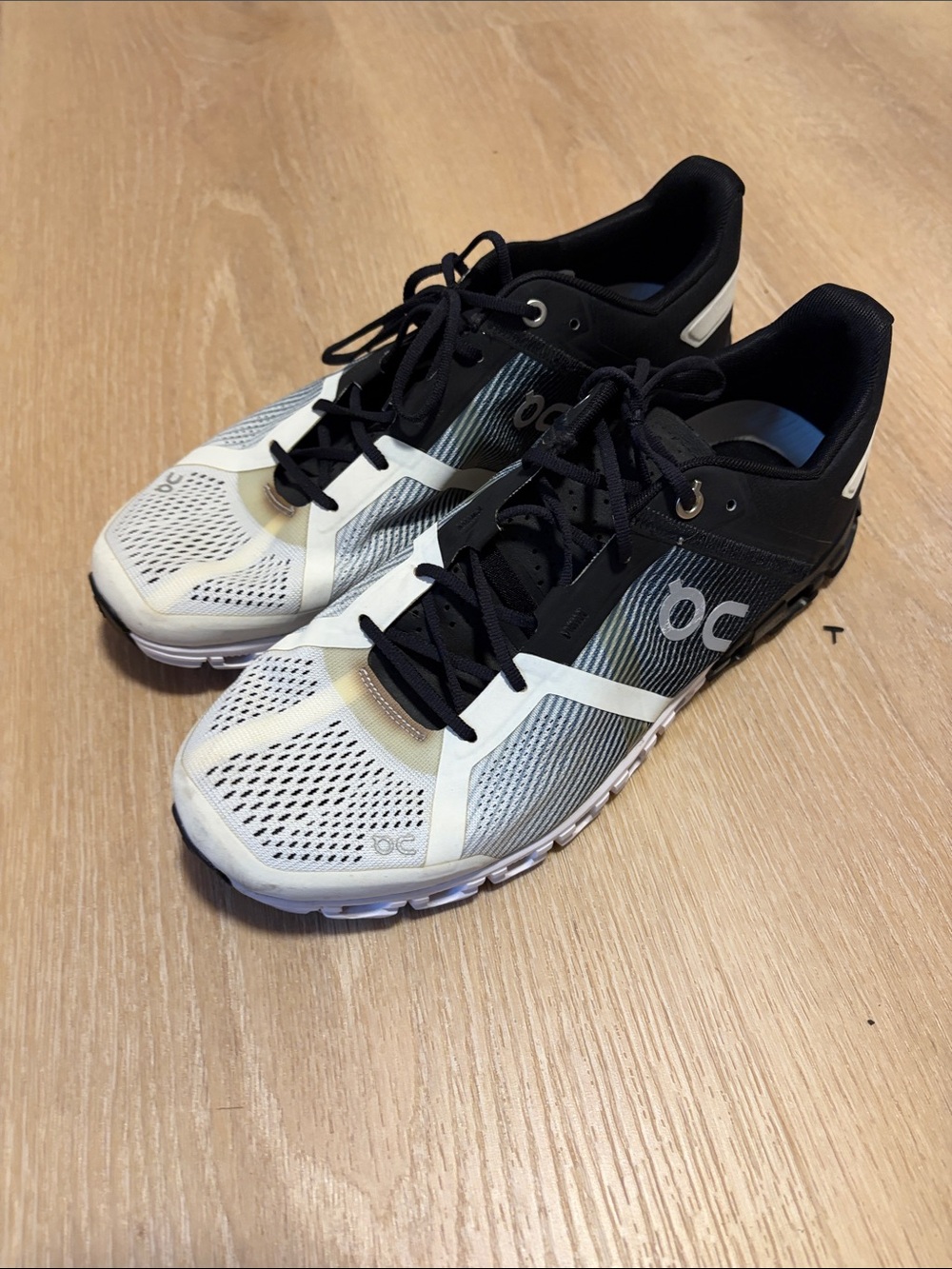 On Running Men's Cloudflow Lightweight Running Shoes in Black and White